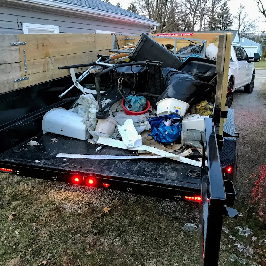 Roll-off dumpster delivered to a residential driveway in Ludington